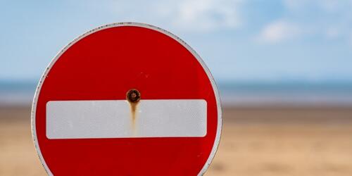 Stop sign on a beach
